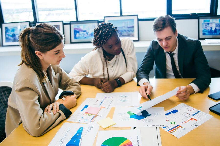 business-team-meeting-with-stats-and-review-graphs-of-company-target-goals-market-research