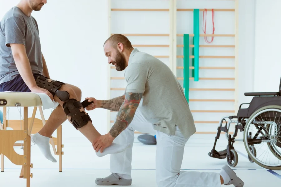 helpful-professional-physiotherapist-helps-the-pat-2023-11-27-04-57-26-utc